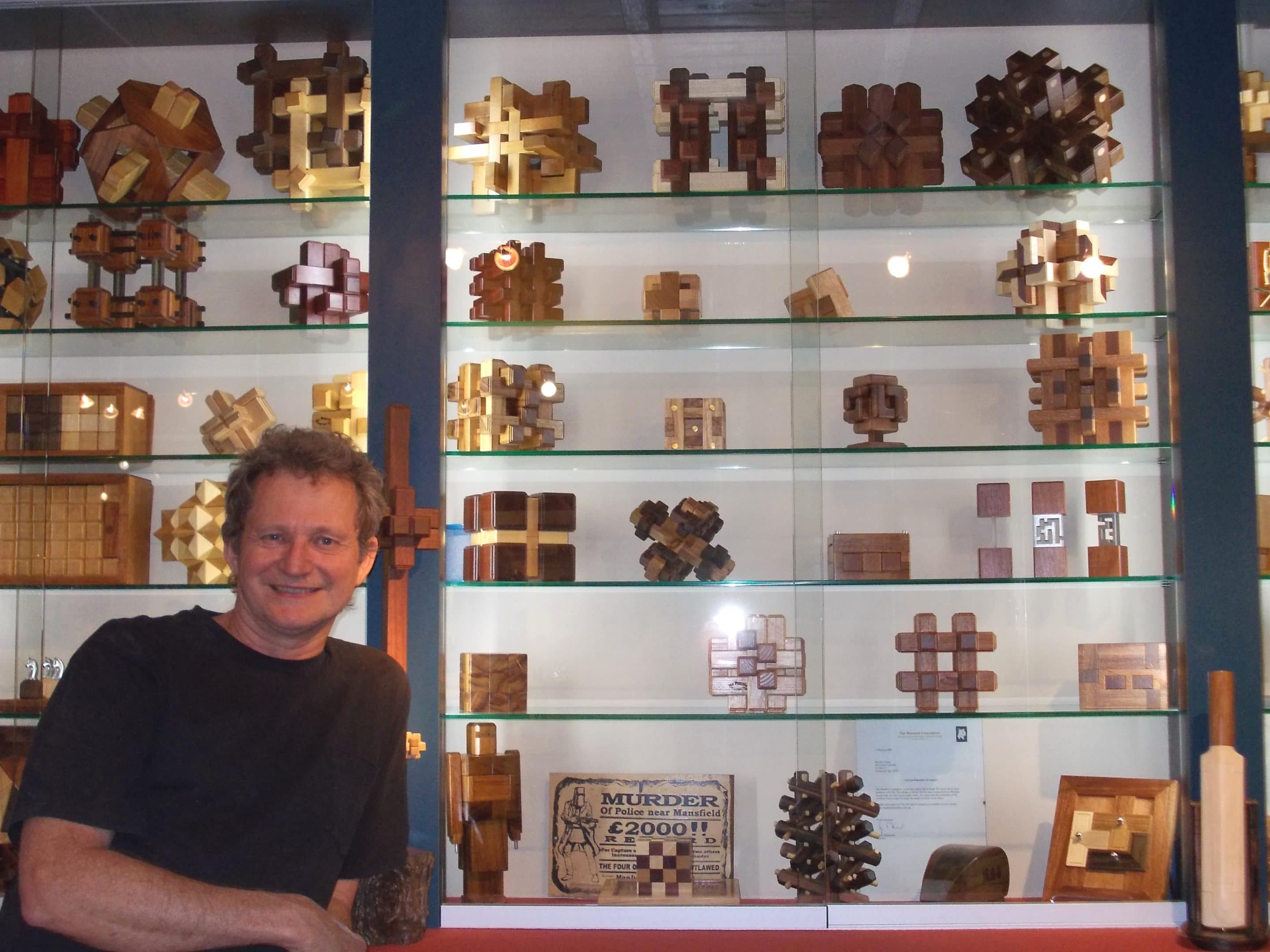 Brian and some of the #1 Limited Edition puzzles he displays in his puzzle room.