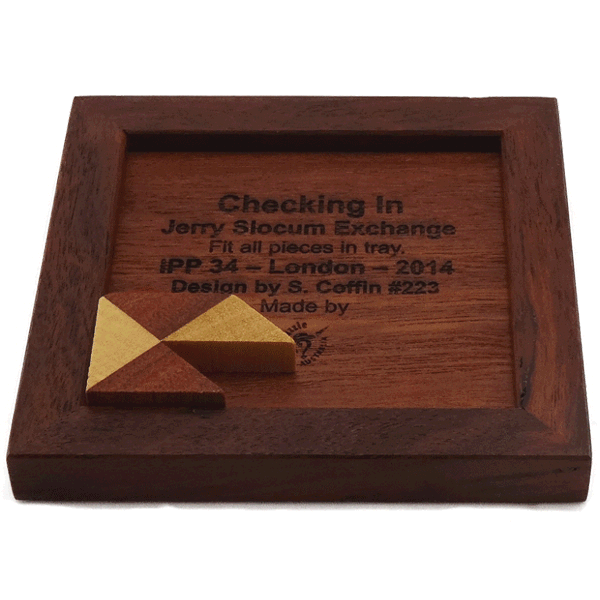 Checking In checkerboard packing tray puzzle by Stewart Coffin